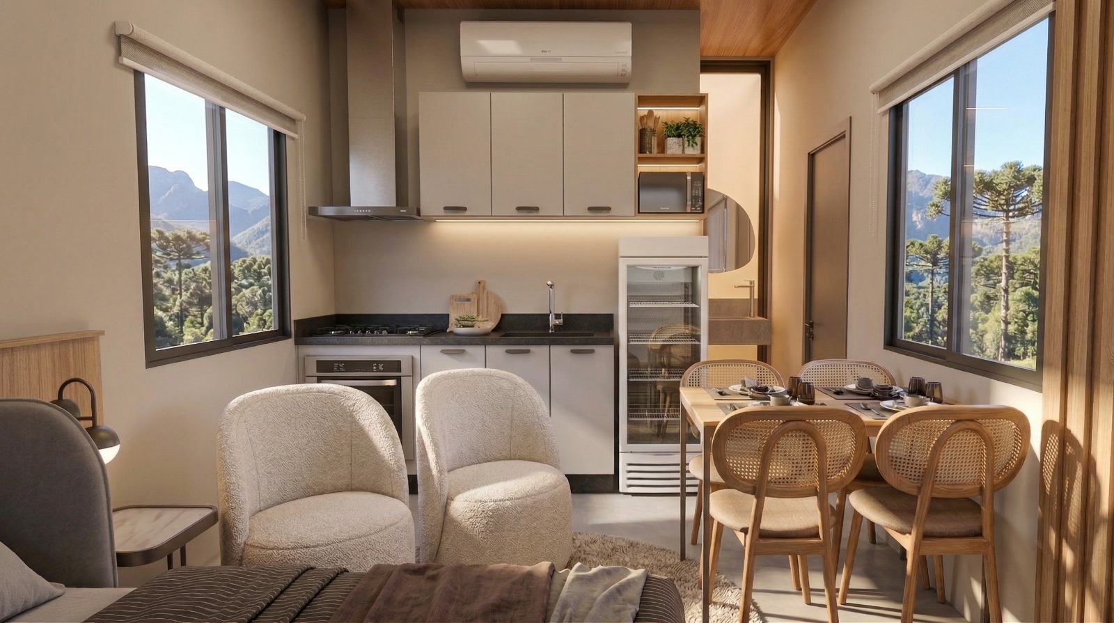 Cabana Sunset — cozinha compacta com armários claros, bancada escura e mesa de refeições